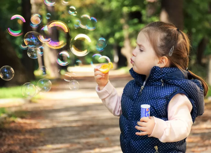 Kid blowing bubbles