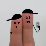 fingers with faces representing teens communicating
